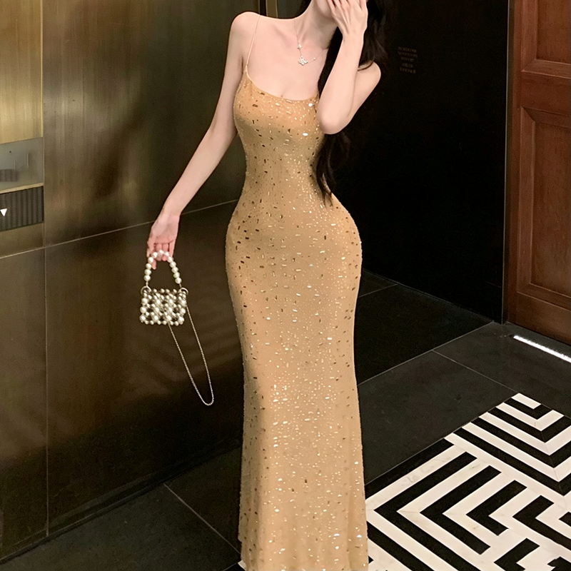 Champagne-colored shimmering dress with delicate straps