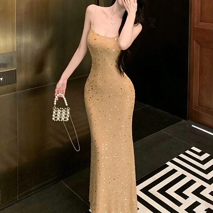 Champagne-colored shimmering dress with delicate straps